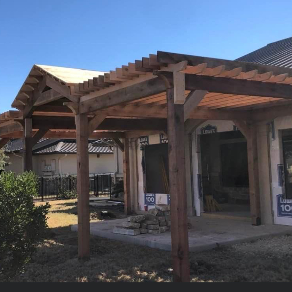 Sturdy wooden pergola designed and constructed by Alamo City Decks and Patios, enhancing outdoor living spaces.